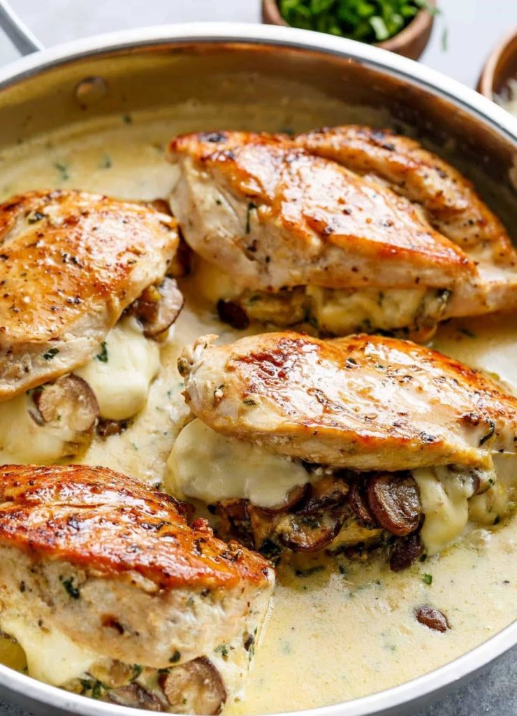 Cheesy garlic butter mushroom stuffed chicken - TASTYDONE