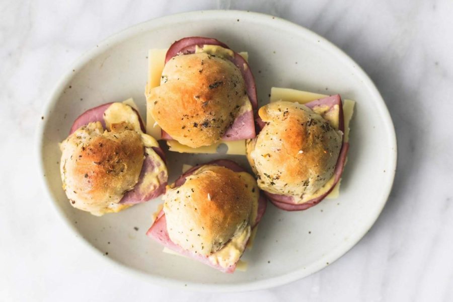 HAM AND CHEESE SLIDERS ON BUTTERY HERB ROLLS