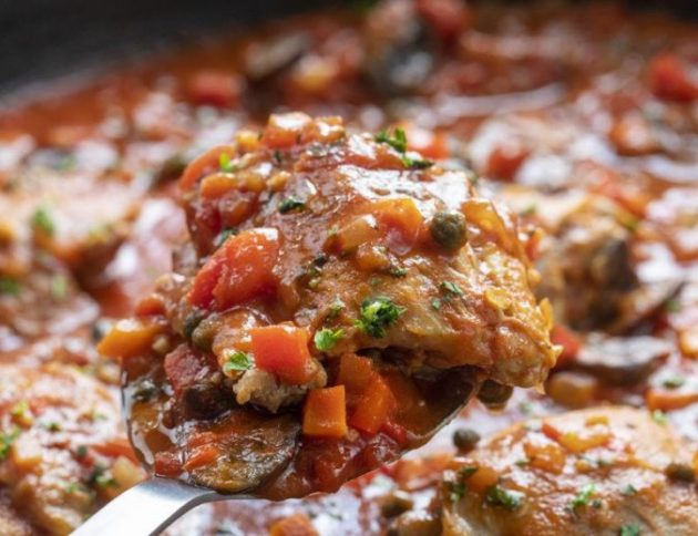 Chicken Cacciatore in a tomato-based sauce full of herbs and vegetables