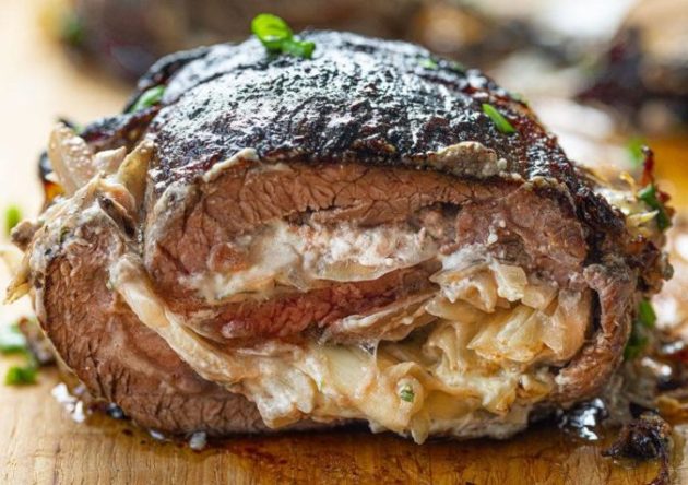 Grilled flank steak stuffed with cream cheese and onion mixture