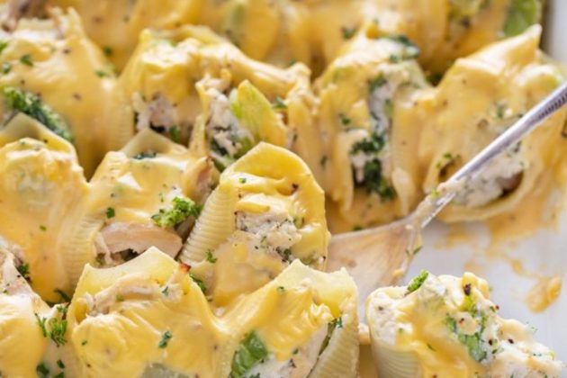 Awesome shells filled with shredded chicken, broccoli, cheese and topped with cheddar cheese sauce