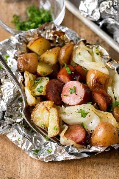 Tender potatoes, smoky sausage and sweet cabbage foil packets