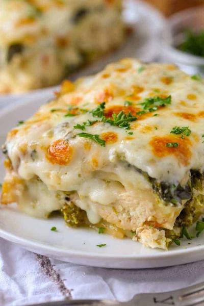 Chicken Lasagna Layered with Veggies and Cheese in a Rich Creamy Alfredo Sauce