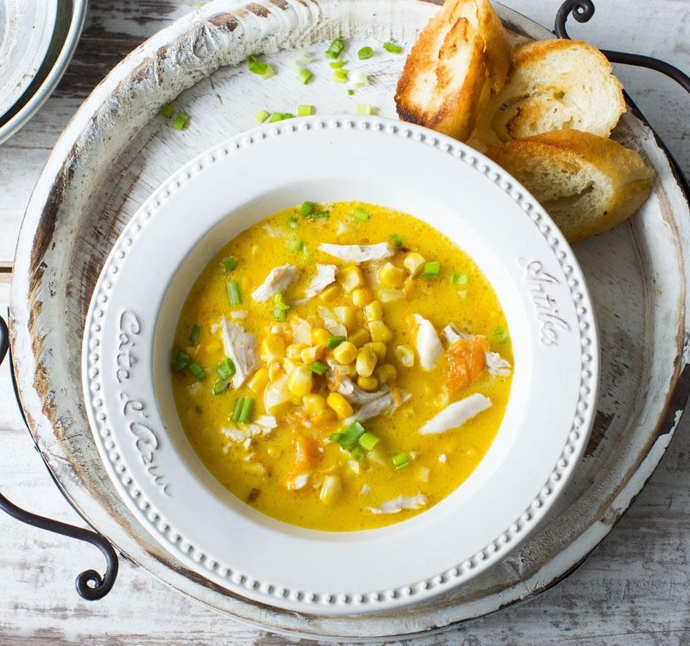Flavorful homemade chicken soup with corn and pumpkin
