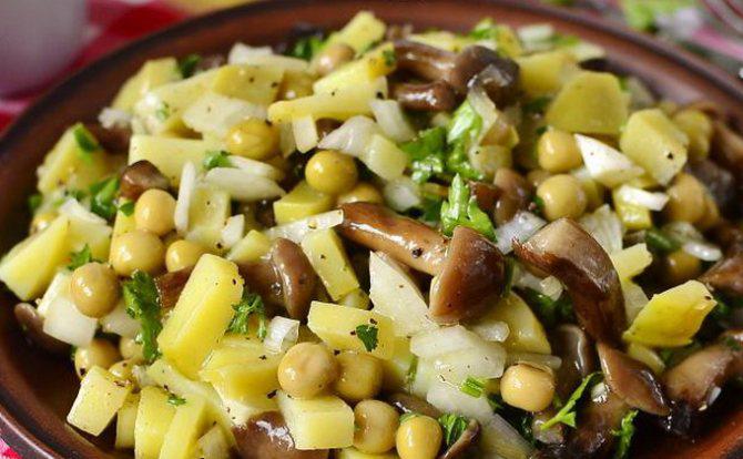 Potato salad with pickled mushrooms and green peas